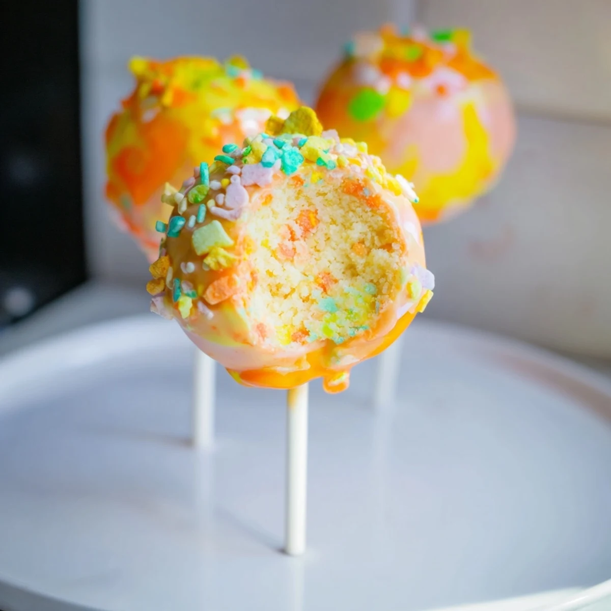 Fluffy Classic Soda Candy Cake Pops coated in vibrant candy shell, perfect for celebrations.  