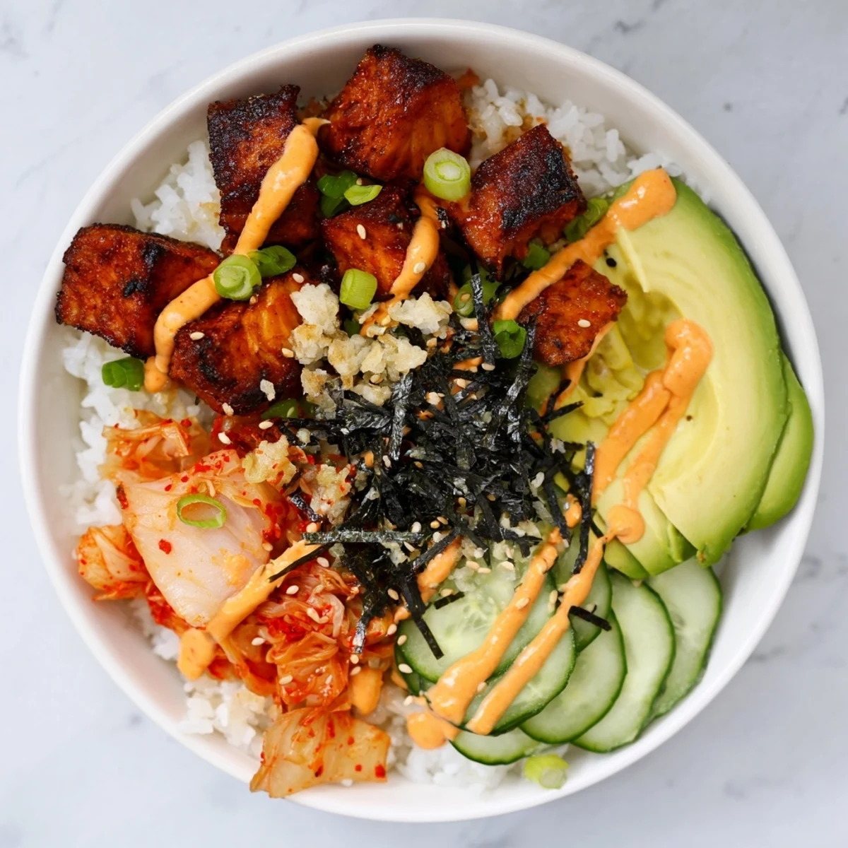Flavorful crispy salmon rice bowl with fluffy rice and crunchy fresh vegetables.