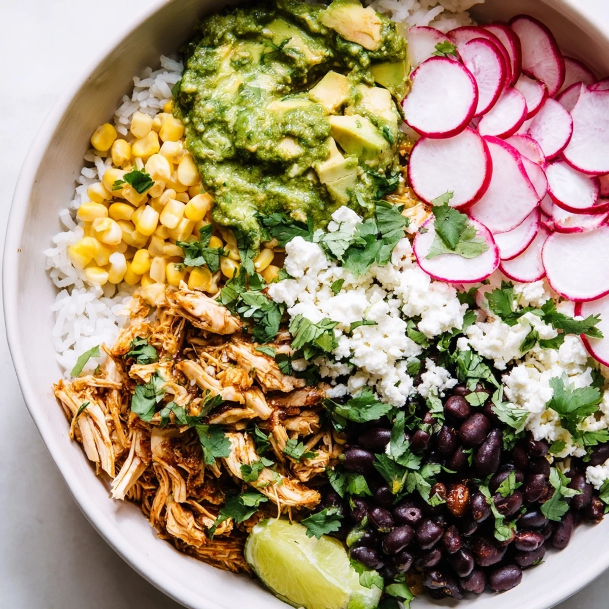 Satisfying Green Enchiladas Rice Bowl featuring zesty sauce, chicken, and colorful toppings.  