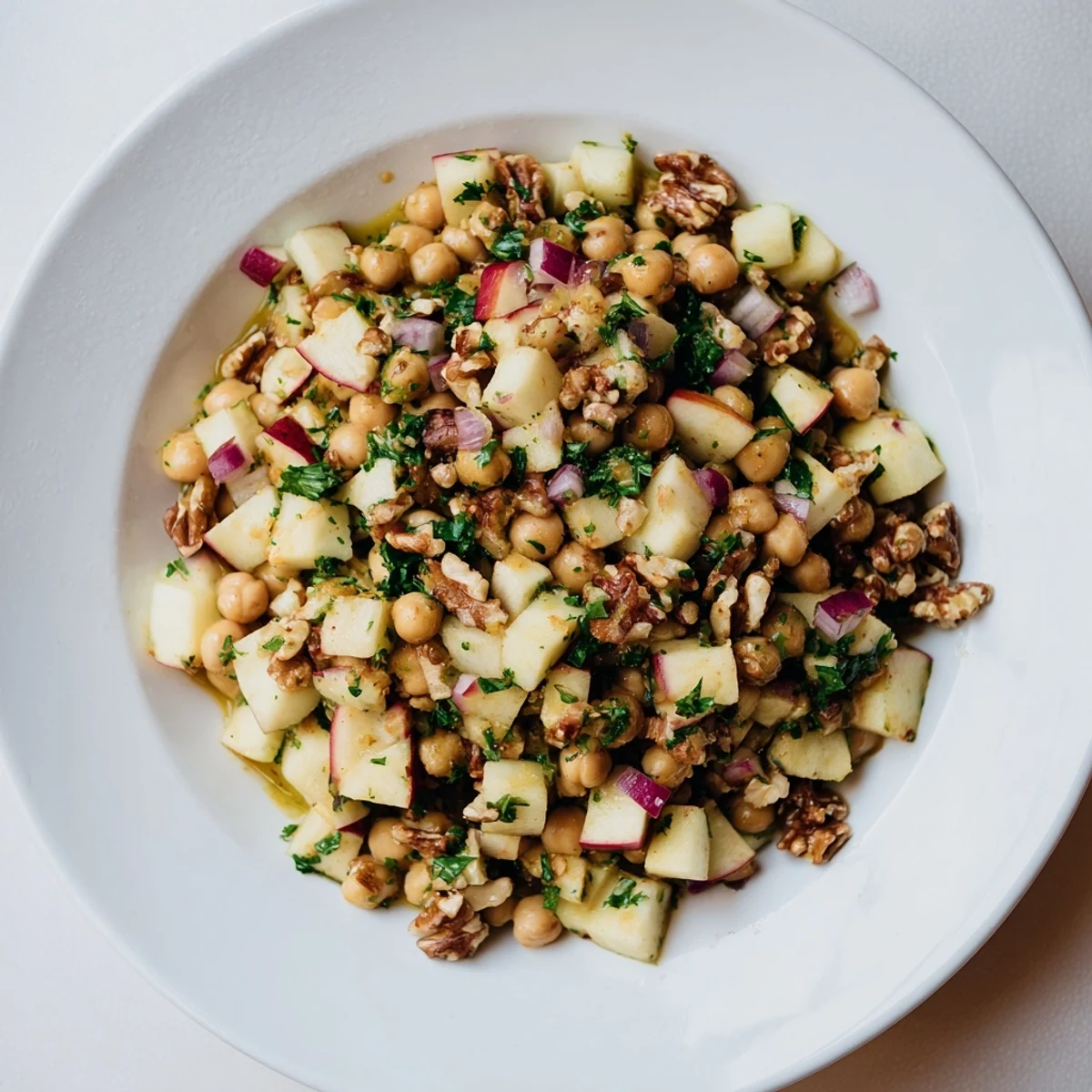 Vibrant Autumn Harvest Apple and Chickpea Salad brimming with crisp apples, ready to be enjoyed.