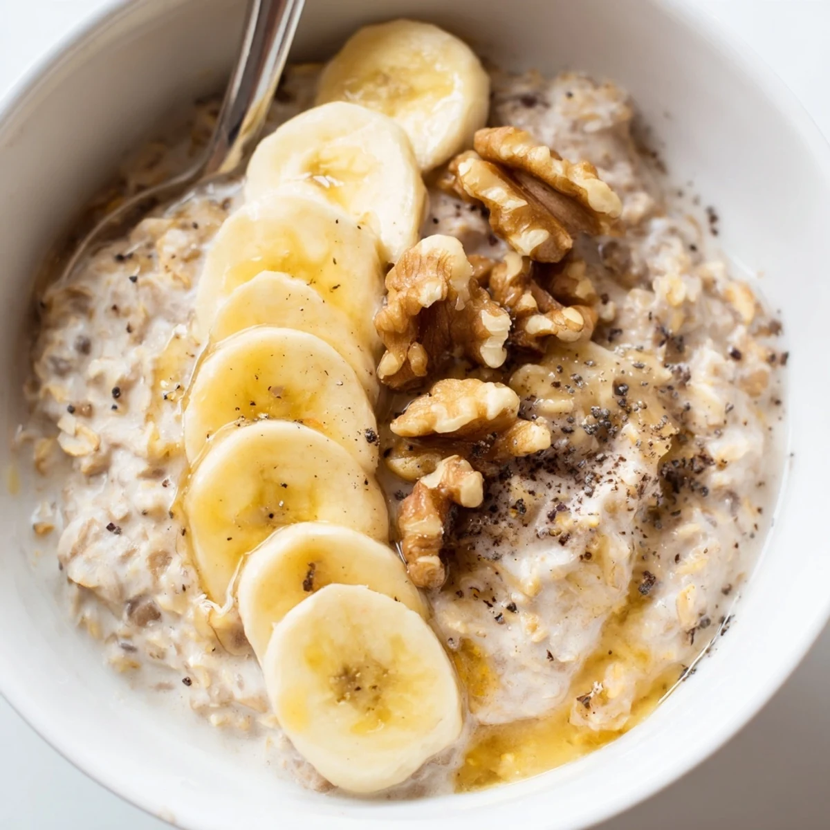 Steaming bowl of Microwave Banana Oats with sliced bananas, a quick and comforting American breakfast.