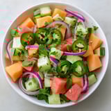 Close-up of a Cucumber and Watermelon Hot Girl Salad, showcasing the bright colors and textures of the ingredients.