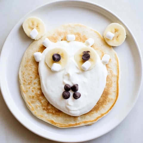 Fluffy Polar Bear Pancake Stack Board with fresh fruit and whipped cream for a whimsical brunch.