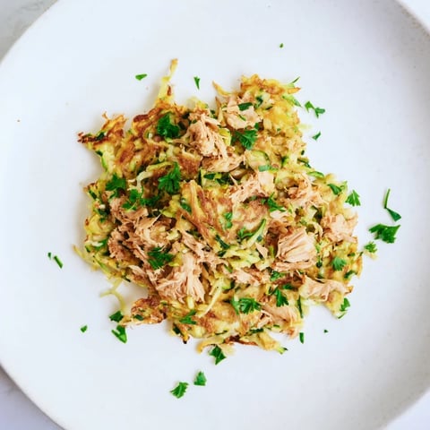 Golden-brown High-Protein Chicken Zucchini Fritters, crispy on the outside, a flavorful and hearty appetizer.