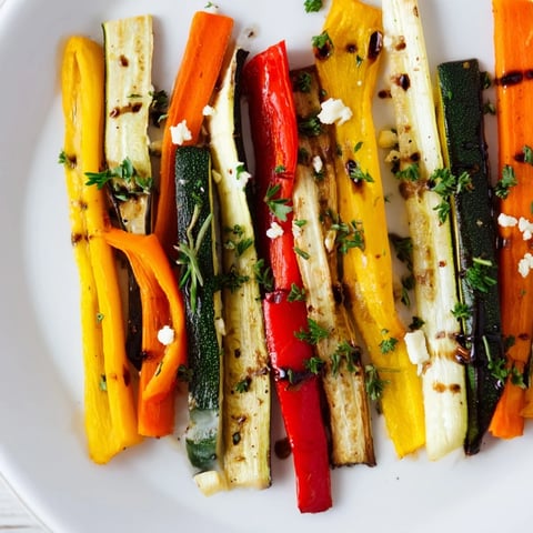 Roasted Christmas Sleigh Veggie Rails, with colorful, tender vegetables arranged on a platter ready to serve.