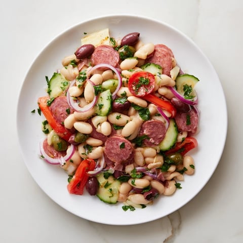 Italian Antipasto Bean Salad, a colorful mix of beans, salami, and veggies, ready to enjoy.