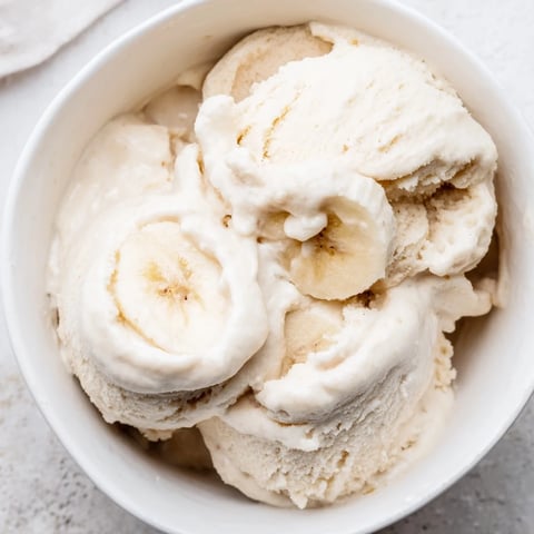 A refreshing bowl of 2-Ingredient Banana Ice Cream, perfectly smooth and creamy after blending.