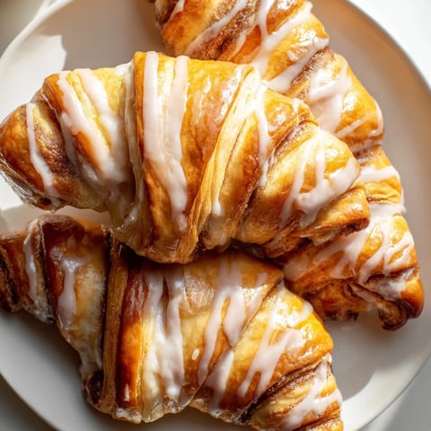 Air-Fryer Cinnamon Roll Twists: Golden, glazed and swirled, ready for breakfast—perfectly air-fried cinnamon-sugar pastries.