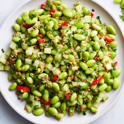 Vibrant edamame salad with crisp cucumber and savory sesame dressing, ready to enjoy.