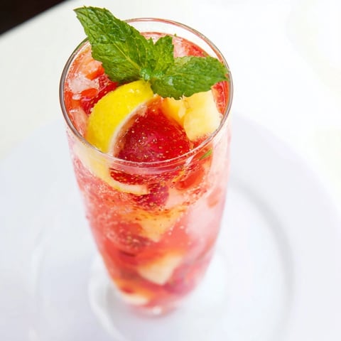 Homemade DIY Fruit Refresher Drinks overflowing in a pitcher, perfect for a summer gathering, so refreshing.