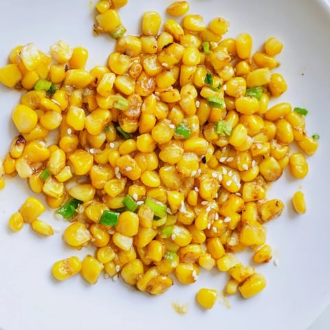 Golden, glistening Japanese Butter Corn with scallions, a delightful side dish ready to be served.