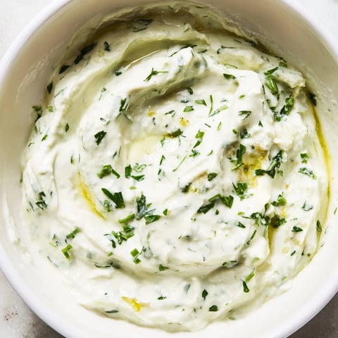 Creamy Green Goddess Salad Dip, thick and vibrant green, ready to scoop with chips and veggies.