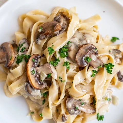 Golden, sautéed cremini mushrooms and garlic in a velvety Creamy Mushroom Alfredo sauce tossed with fettuccine.