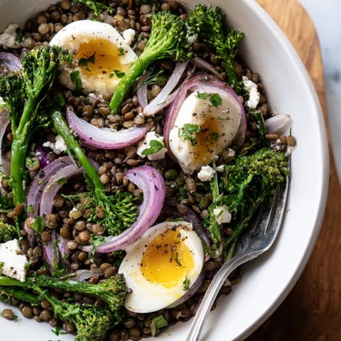 French Lentil Salad with vibrant broccolini and soft-cooked eggs drizzled in Dijon vinaigrette.