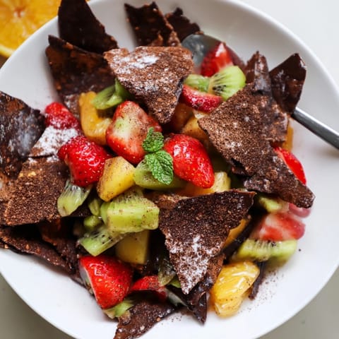 Homemade chocolate tortilla Dessert Chips & Salsa served with vibrant fruity dip.  