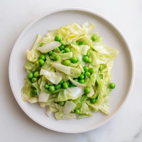 Close-up of a colorful cabbage stir-fry with garlic and soy sauce, ready to serve hot.