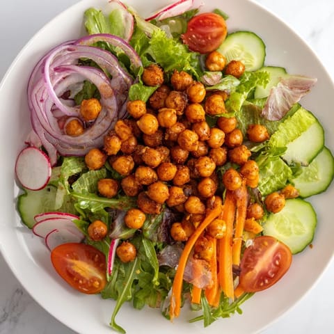 Imagine the textures – the crispy croutons atop a bed of mixed greens in this delicious salad.