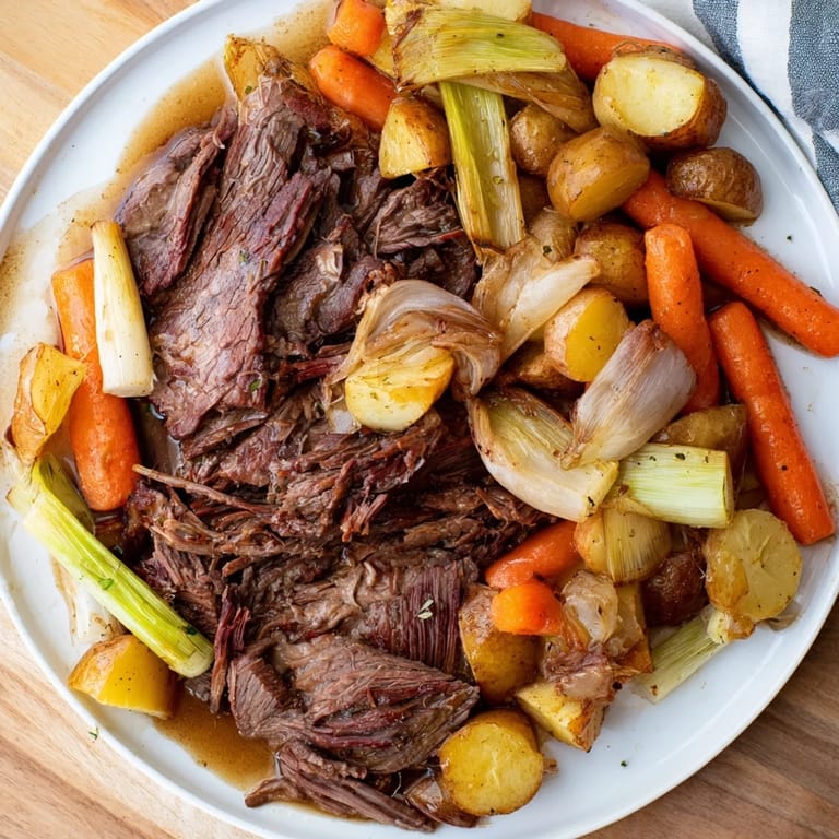 A flavorful, gluten-free Sunday Pot Roast, showcasing juicy meat and perfectly cooked carrots and potatoes.