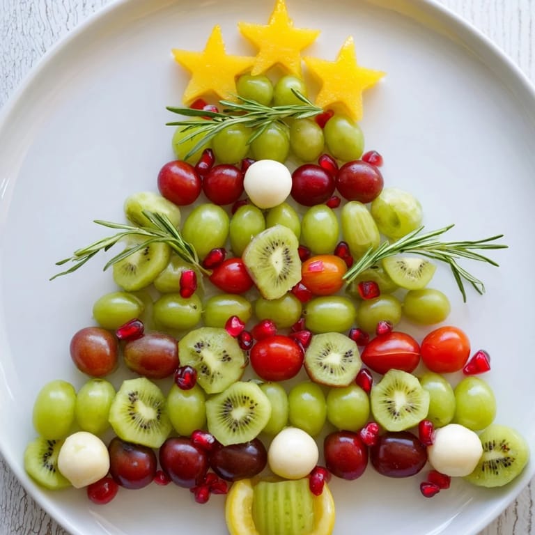 This Christmas Tree Triangle Board appetizer shows a beautifully arranged vegetarian delight, perfect for seasonal gatherings.