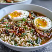 Hearty homemade miso ramen with rich broth, tender mushrooms, and a soft-boiled egg for a cozy meal.