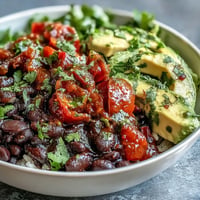 Vibrant plant-based taco bowl brimming with savory black beans and fresh salsa.
